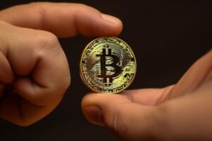 Hand Holding Bitcoin