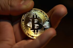 Hand Holding Bitcoin