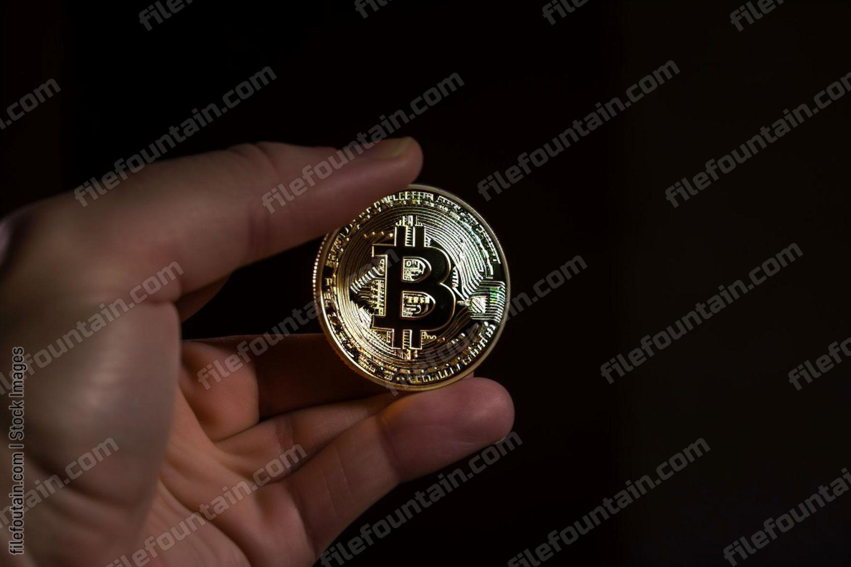 Hand Holding Bitcoin