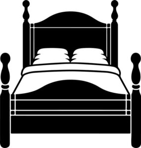 bed with duvet and two pillows